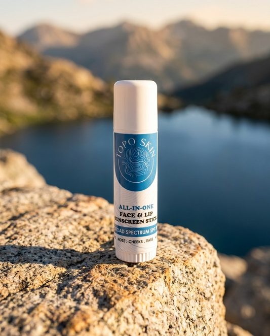 Topo Skin sunscreen stick on granite by an alpine lake